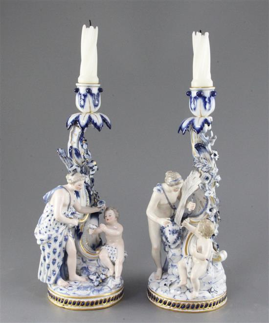 A pair of Meissen figural candlesticks, late 19th century, height 29cm, some losses